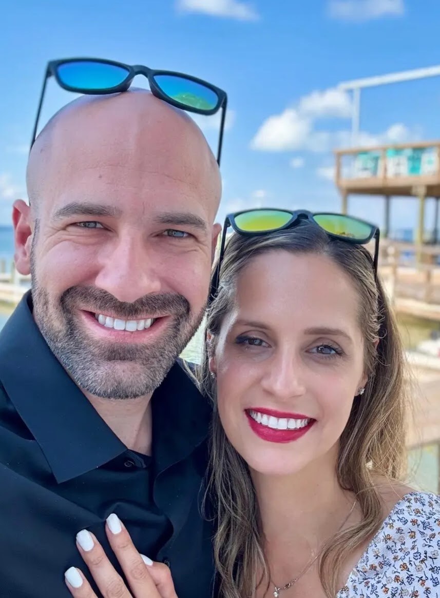 Ashley Ann and her husband Matthew smiling together